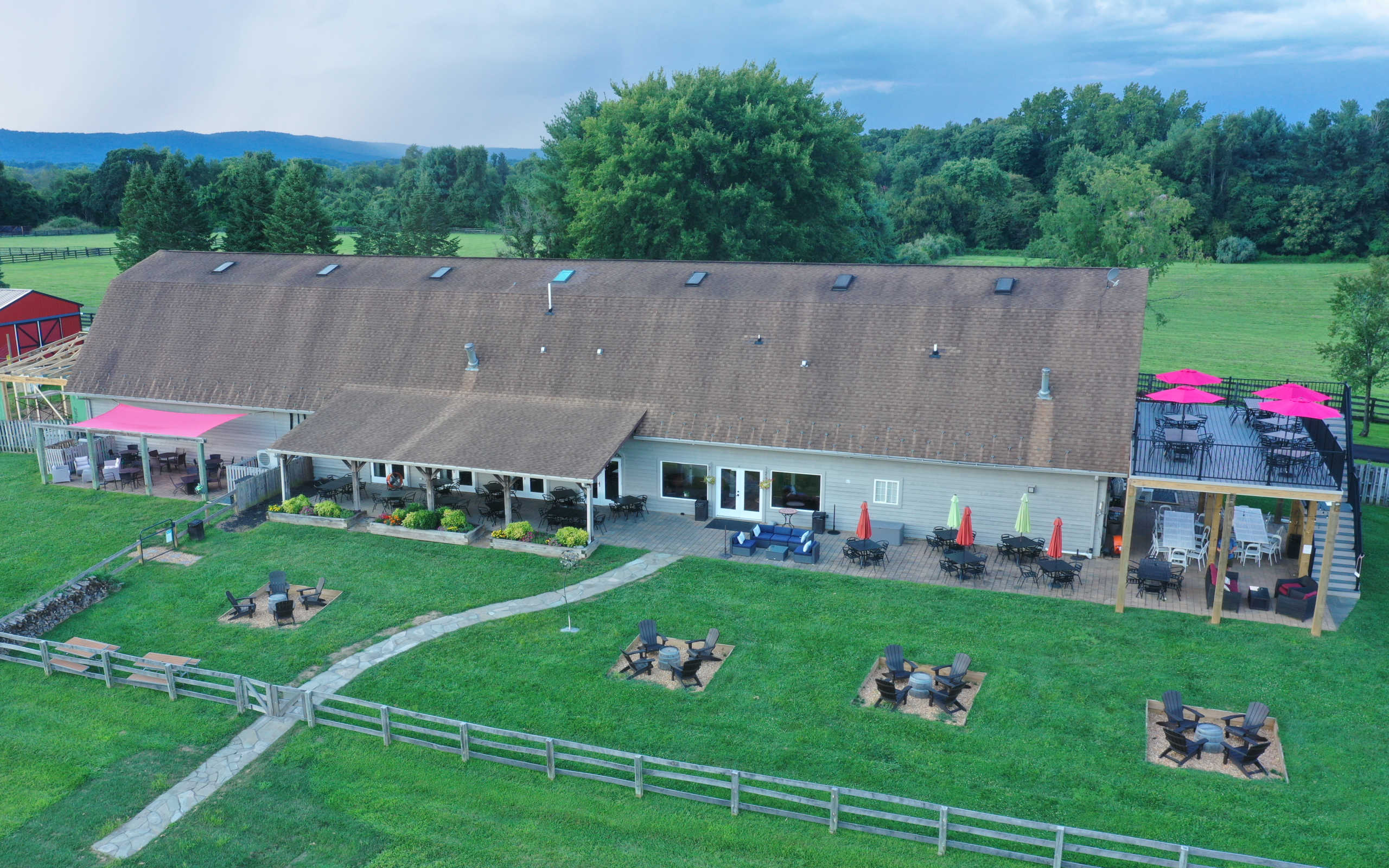 drone shot of the winery showing extensive lawn, patio, and deck spaces for private events