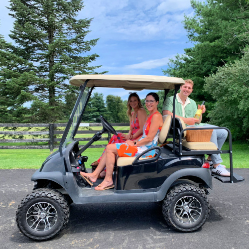 golf cart ride to vineyard picnic
